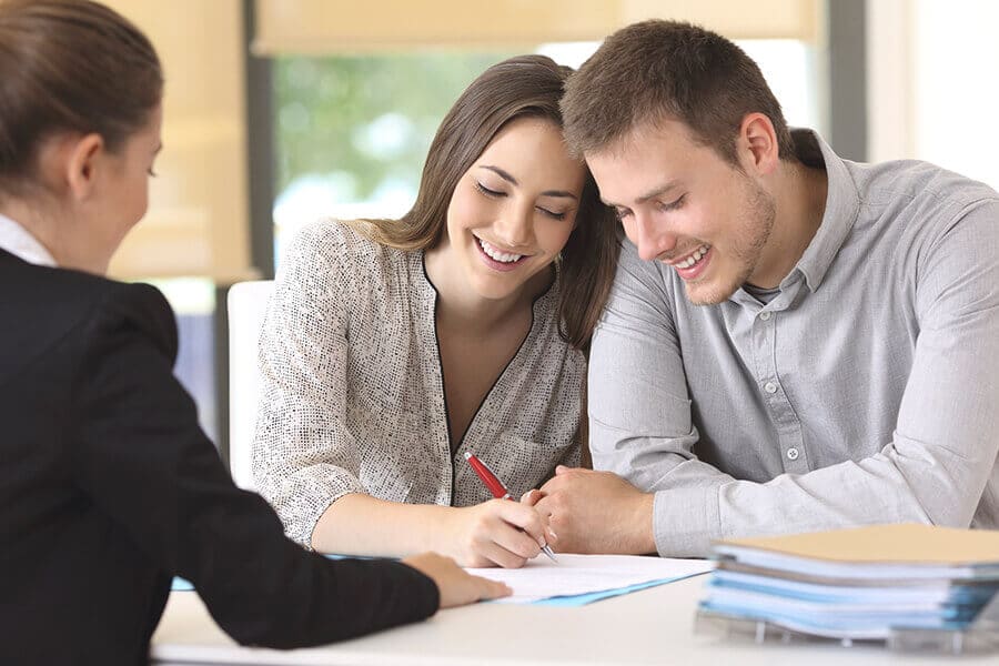 Couple Signing Renters Insurance