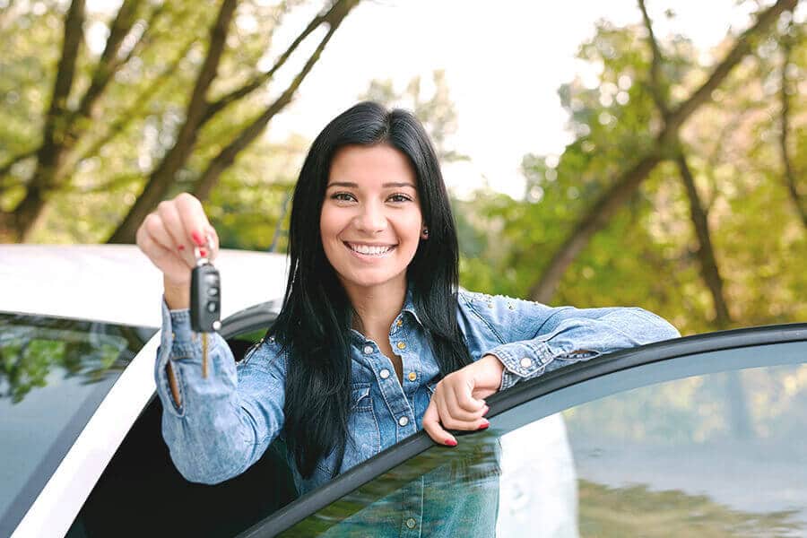 Lady driver holding car keys