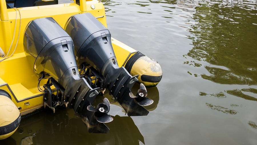 yellow boat with blown engine