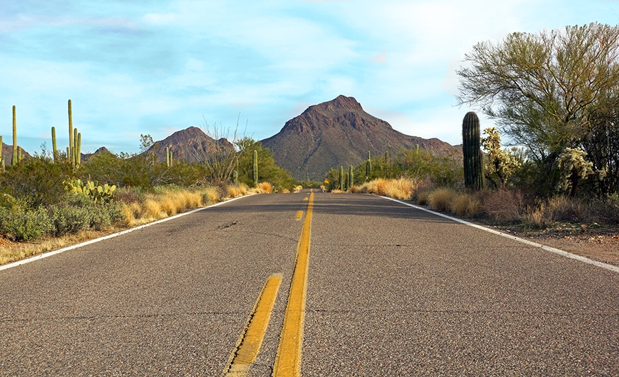 Highway runs through the Sonoran desert leading to the mountain peak